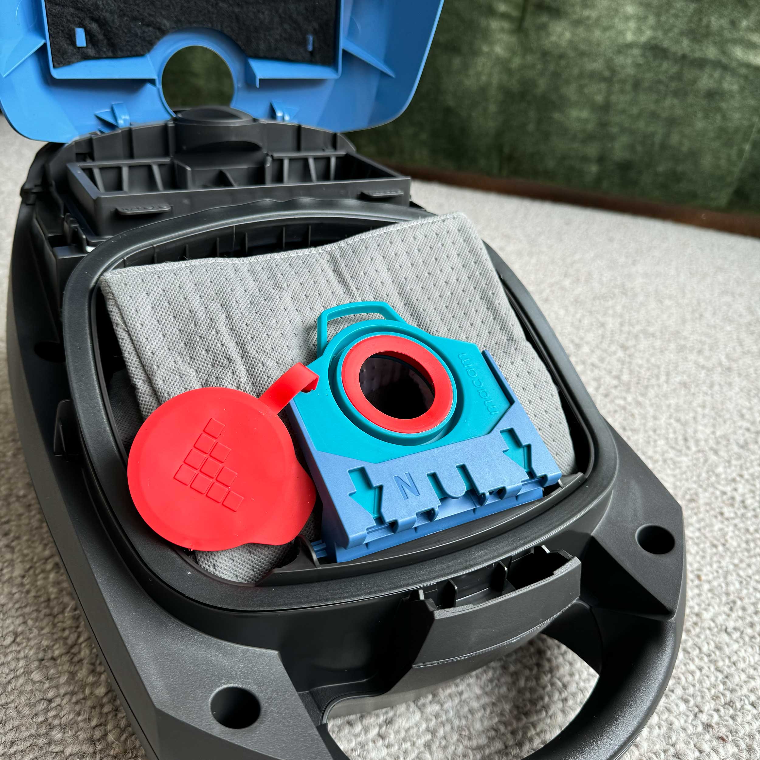 Reusable dust bag for Miele Classic/Complete shown with vacuum cleaner accessories